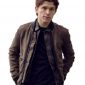 Tom Holland wearing brown cotton jacket on black collar